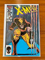 Front cover of The Uncanny X-Men #207 showing Wolverine in classic costume with claws extended.