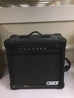 Front view of black Crate GX-15R amplifier showing control knobs and handle.
