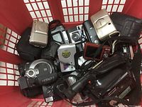Overview of all camcorders and point-and-shoot cameras in red basket