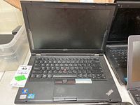 Lenovo ThinkPad T430s 14-inch laptop open showing screen and keyboard with TrackPoint stick, no power cable, angled view.
