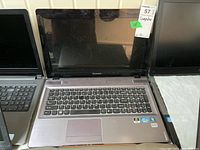 Front view of Lenovo Ideapad Y570 laptop showing keyboard and screen.