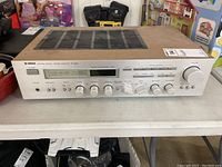 Front view of Yamaha Natural Sound Stereo Receiver R-900 showing overall condition and controls.