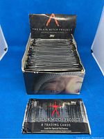 Display box filled with 36 sealed Topps The Blair Witch Project trading card packs.