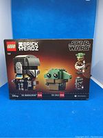 Front view of unopened LEGO BrickHeadz set box 75317 featuring The Mandalorian and The Child (Grogu) figures.