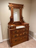 Full front view of Eastlake style dresser with mirror showing overall design and condition