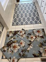 Rugs in bathroom setting showing floral and geometric patterns