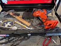 Selection of tools in open Craftsman tool drawer showing various hand tools and power drill