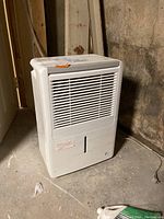 Full view of white Energy Star 4PAD50 dehumidifier with front air vent and body.