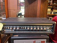 Full front view of Acoustic 150 amplifier showing controls and overall condition