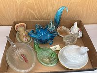The full lot in a box showing all hen on nest pieces, blue ruffled dish, and turkey figurine.