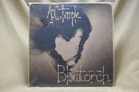 Front cover of A.C. Temple Blowtorch album with abstract dark artwork
