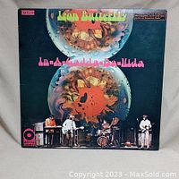 Front cover of Iron Butterfly 'In-A-Gadda-Da-Vida' vinyl LP showing psychedelic artwork and band playing.