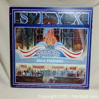 Front of Styx Paradise Theatre album cover showing marquee and theater entrance artwork.