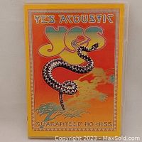 Front cover of the Yes Acoustic DVD, showing colorful psychedelic art with a snake and yellow border