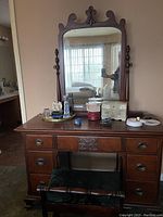 Full view of antique vanity with attached mirror, some items on top not included.