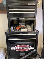 Front view of black Craftsman top chest stacked on bottom rolling cabinet