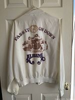 Back of white Alabama jacket showing band graphic and 'Pass It On Down' text