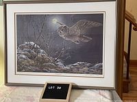 Full view of framed print showing owl in flight over hare beneath full moon in winter landscape