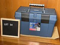 Closed blue plastic Mastercraft toolbox with handle and two black latches on front, labeled 17 inch.