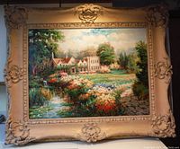 Frontal view of the oil painting inside carved wood frame, showing detailed manor house, vibrant floral garden, and pond scene.