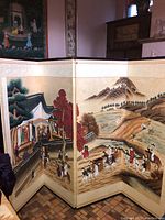 Full view of the screen showing four panels with detailed painted scenes of Korean traditional village life and travelers.