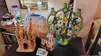 Overview of five southwest ceramic folk art pieces including a candelabra, vase, and figurines