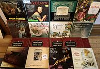 Display of 12 LP records and 5 Philharmonic Great Music box sets, including Liberace La Traviata, Roger Williams, Debussy, and others.