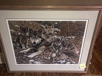 Framed print leaning against wall showing overall condition, mat and frame