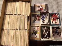 Box filled with hundreds of hockey cards tightly packed