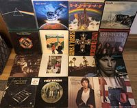 Four rows of four album covers each including Pink Floyd, Rainbow, Rush, ELO, Guns N’ Roses, Deep Purple, Supertramp, Bruce Springsteen