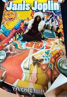 Colorful Janis Joplin poster showing her on a painted hippie car with 'On Columbia' text