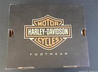 Black Harley-Davidson branded shoebox top showing logo and the word 'Footwear'