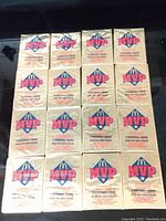 Sixteen unopened 1992 Donruss McDonalds MVP Baseball Card packs arranged in a 4x4 grid, showing front side with McDonalds MVP logo and text indicating 4 baseball cards per pack.