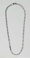 Full view of the sterling silver chain necklace laid flat showing the entire length and clasp detail.