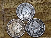 Obverse view showing the Native American head profile on each coin dated 1890, 1892, and 1900.