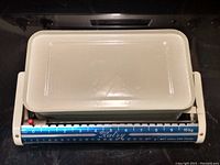 Top view of the vintage Katry Ketchen mechanical kitchen scale displaying the weighing platform and blue measurement dial with kilogram markings from 0 to 10 kg.