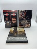 Front view of three horror DVD cases: Child's Play 2 & 3 double feature, Killer Klowns from Outer Space, and Leatherface.