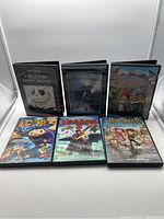 Front view of six animated family DVD movies showing cover art including The Nightmare Before Christmas, The Polar Express, and others.