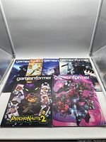 Front view of six Game Informer magazines showing various video game-themed covers including Psychonauts 2
