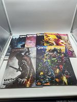 Lot of 7 Game Informer magazines laid out with front covers visible showing game artwork such as Sekiro and Marvel Ultimate Alliance 3.