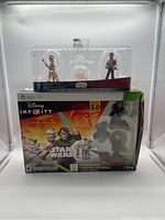 Full lot showing Disney Infinity Star Wars Xbox 360 game starter pack box and boxed figures on top