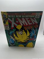 Front cover photo showing the entire book with Wolverine in yellow and blue costume and title text
