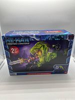 Front view of the boxed Masters of the Universe Chaos Snake Attack Play Set showing branding, artwork, and contents visible through window.