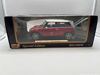 Red Mini Cooper die cast car in original Maisto Special Edition box with clear plastic window.