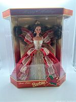 Front view of the Holiday Barbie in box showing doll's outfit and box design