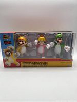 Front view of the sealed box containing the three Super Mario 3D World figures in cat costumes: Mario, Peach, and Luigi.