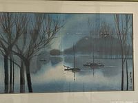 Full view of the framed watercolour painting showing a misty water scene with boats and barren trees.