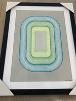 Full front view of framed print with protective corner guards
