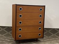 Front elevation of five-drawer teak dresser showing overall design and drawer pulls
