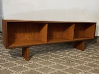 Full front view showing three open cubbies and block legs